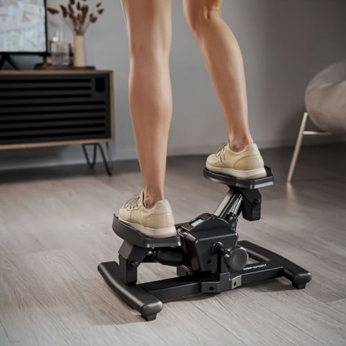 Beine auf Hop-Sport Stepper beim Training für Abnehmen