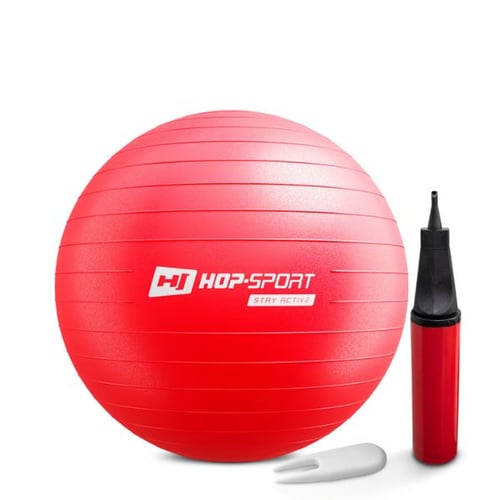 Roter Gymnastikball von Hop-Sport, neben einer Handpumpe und einem weißen Ventilwerkzeug. 