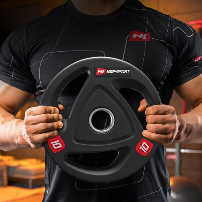 Disque de gym durable avec anneau en acier inoxydable pour barres olympiques 50 mm.